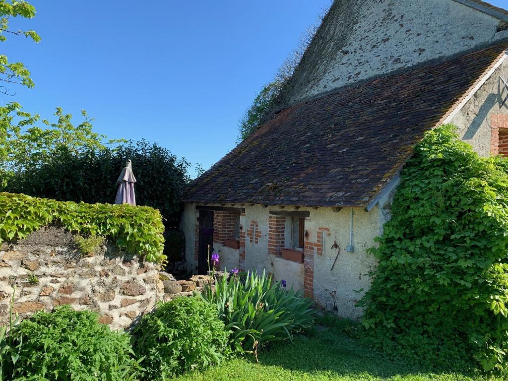 an old stone house with a roof at The Petit Prince Studio at Chateau Mareuil in Brigueuil-le-Chantre