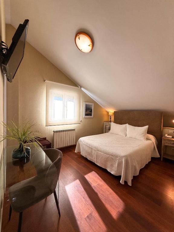 Postel nebo postele na pokoji v ubytování Hotel Verdemar