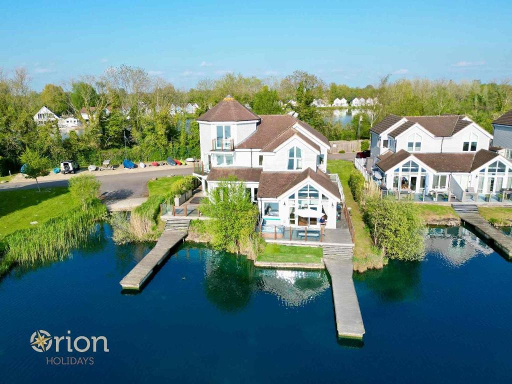 an aerial view of a house on the water at The Landings 18, Waters Reach - P in South Cerney