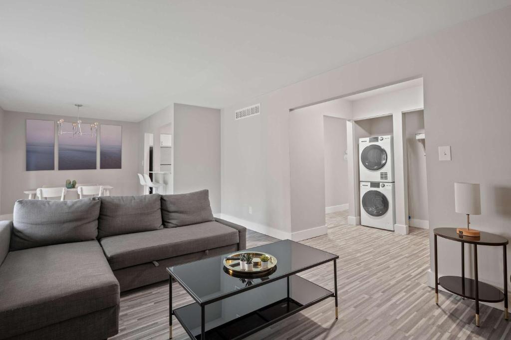 a living room with a couch and a table at Charming Rochester Retreat Cozy & Stylish Stay in Rochester Hills