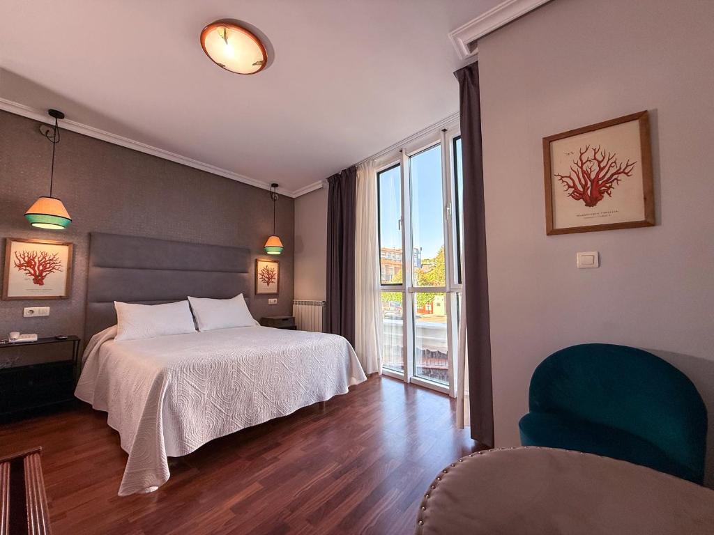 Postel nebo postele na pokoji v ubytování Hotel Verdemar