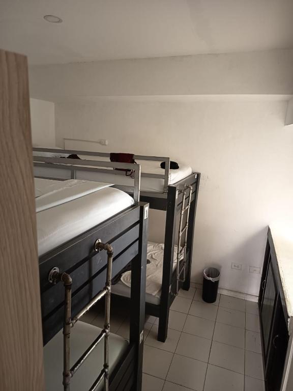 Postel nebo postele na pokoji v ubytování SAN JACINTO HOSTEL