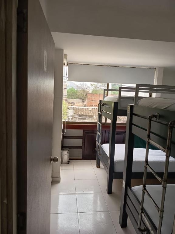 Postel nebo postele na pokoji v ubytování SAN JACINTO HOSTEL