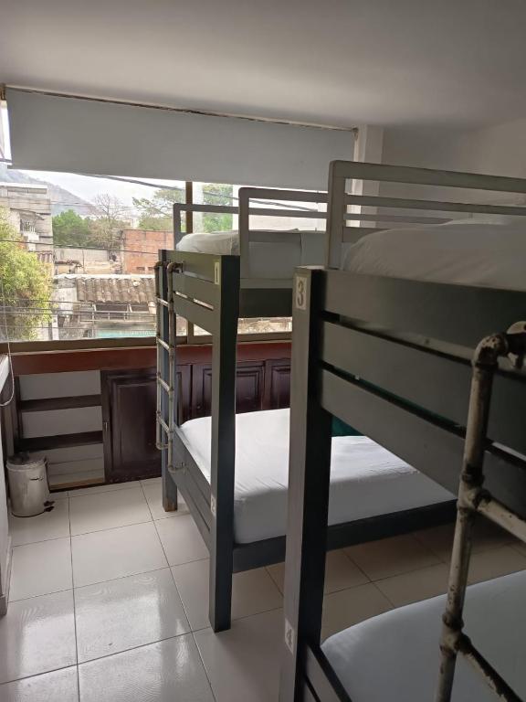 Postel nebo postele na pokoji v ubytování SAN JACINTO HOSTEL