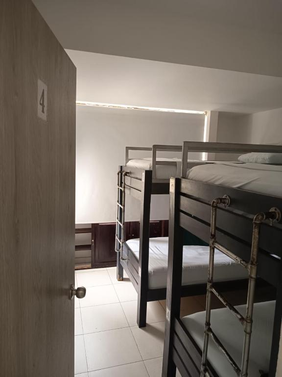 Postel nebo postele na pokoji v ubytování SAN JACINTO HOSTEL