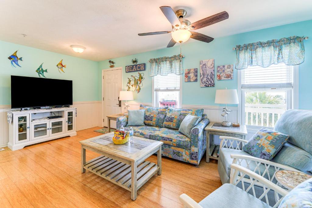 a living room with a couch and a tv at Walk to Beach and Pier Quiet Retreat in Surf City in Surf City