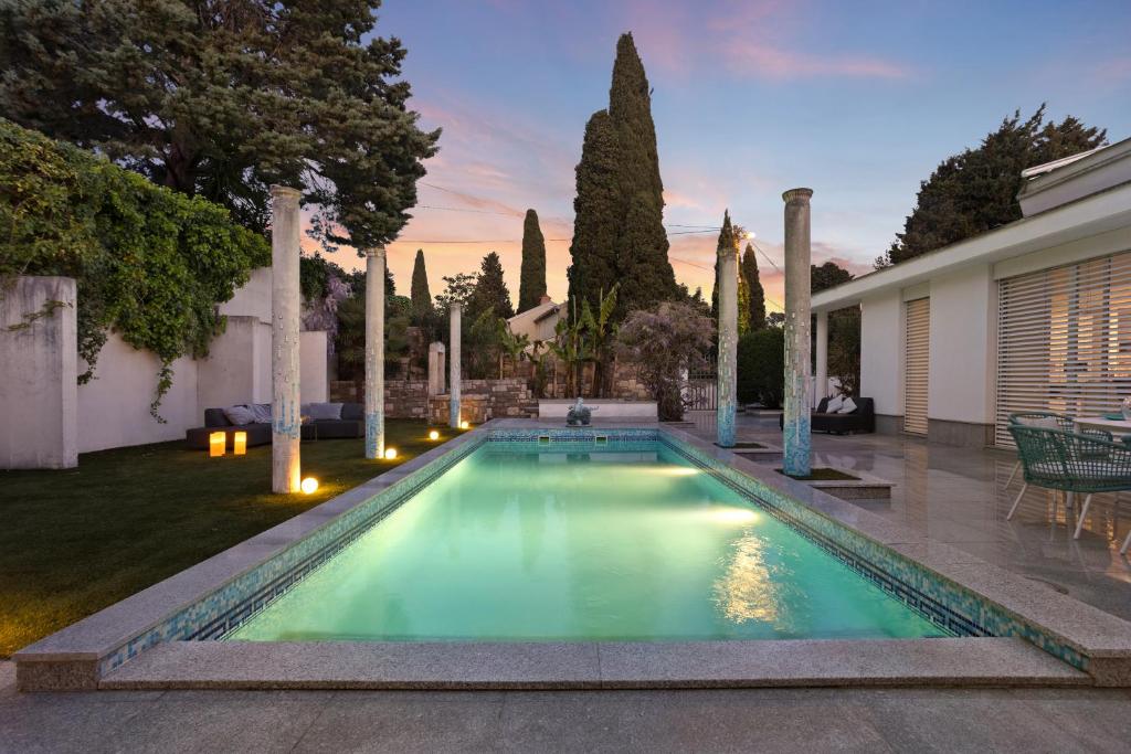 a swimming pool in the yard of a house at Apartmaji Portorož - Portorož Mansion Suites in Portorož