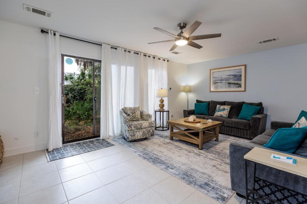a living room with a couch and a table at Pet Friendly, Patio, Close to Beach, QG515 in Hilton Head Island