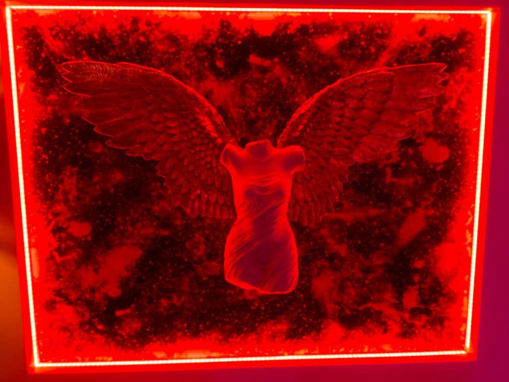 a red picture of an eagle with its wings spread at Cap sur le Paradis in Cap d'Agde