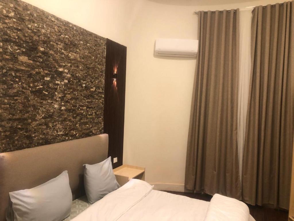 a hotel room with a bed and a large window at Centro Citta Hotel in Cairo