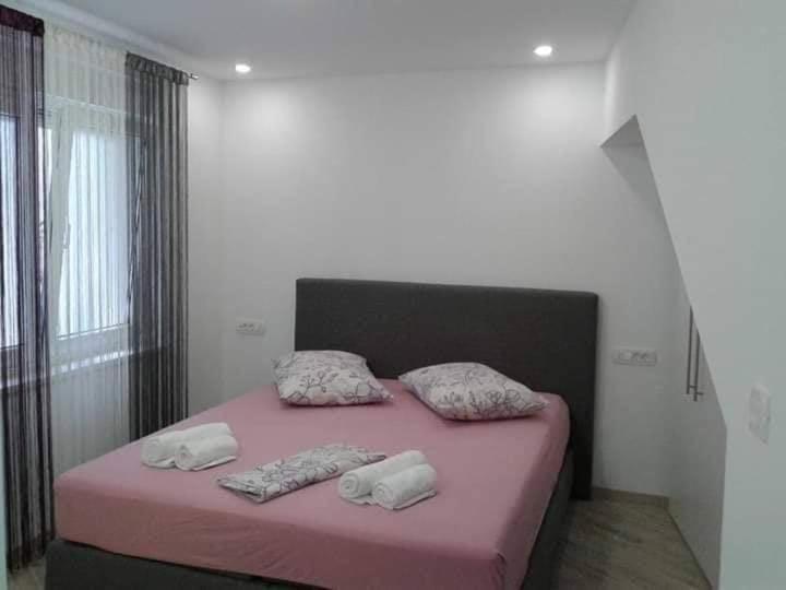 Postel nebo postele na pokoji v ubytování Apartment Nevena