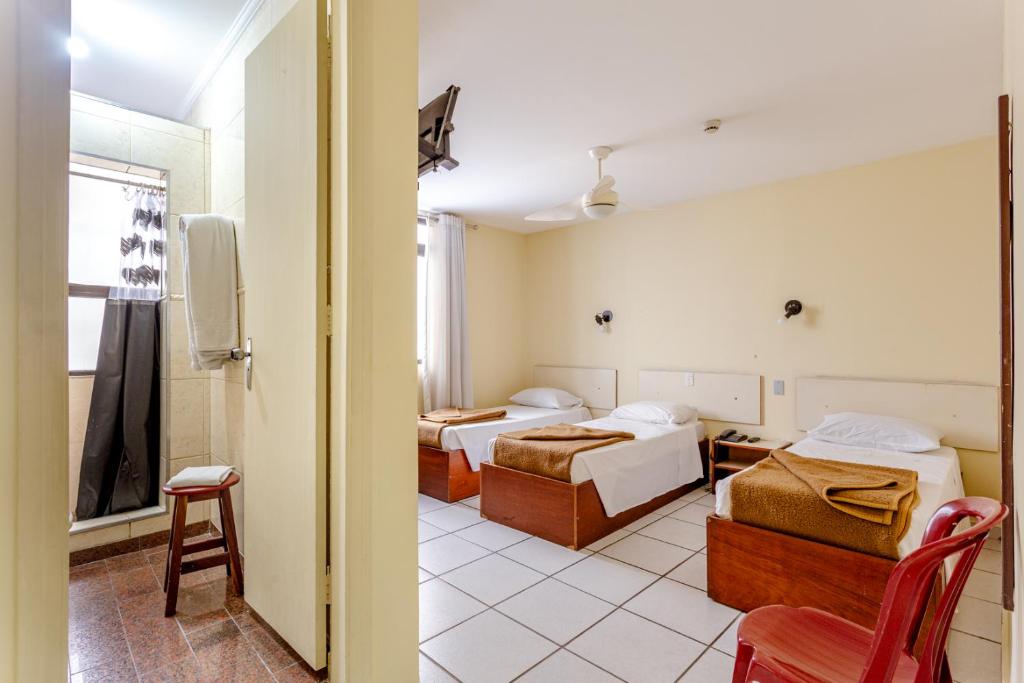 Una cama o camas en una habitación de Daher Center Hotel
