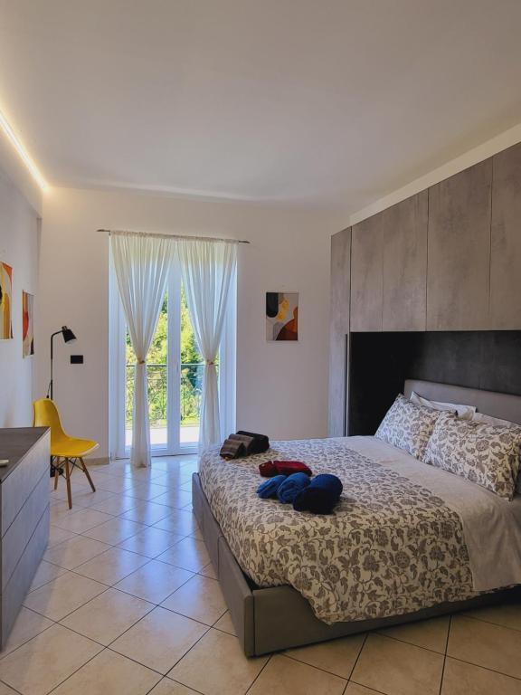 Giường trong phòng chung tại Casa Dolce Casa, a 10 minuti dal mare