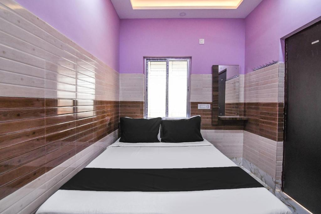 Postel nebo postele na pokoji v ubytování Hotel O PPS NEST Guest House