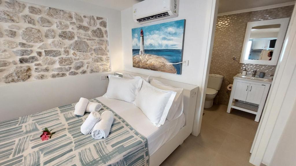 Postel nebo postele na pokoji v ubytování NIOS Luxury House & Studio
