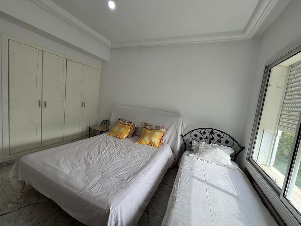 Ένα ή περισσότερα κρεβάτια σε δωμάτιο στο Luxury APP Golf El Kantaoui