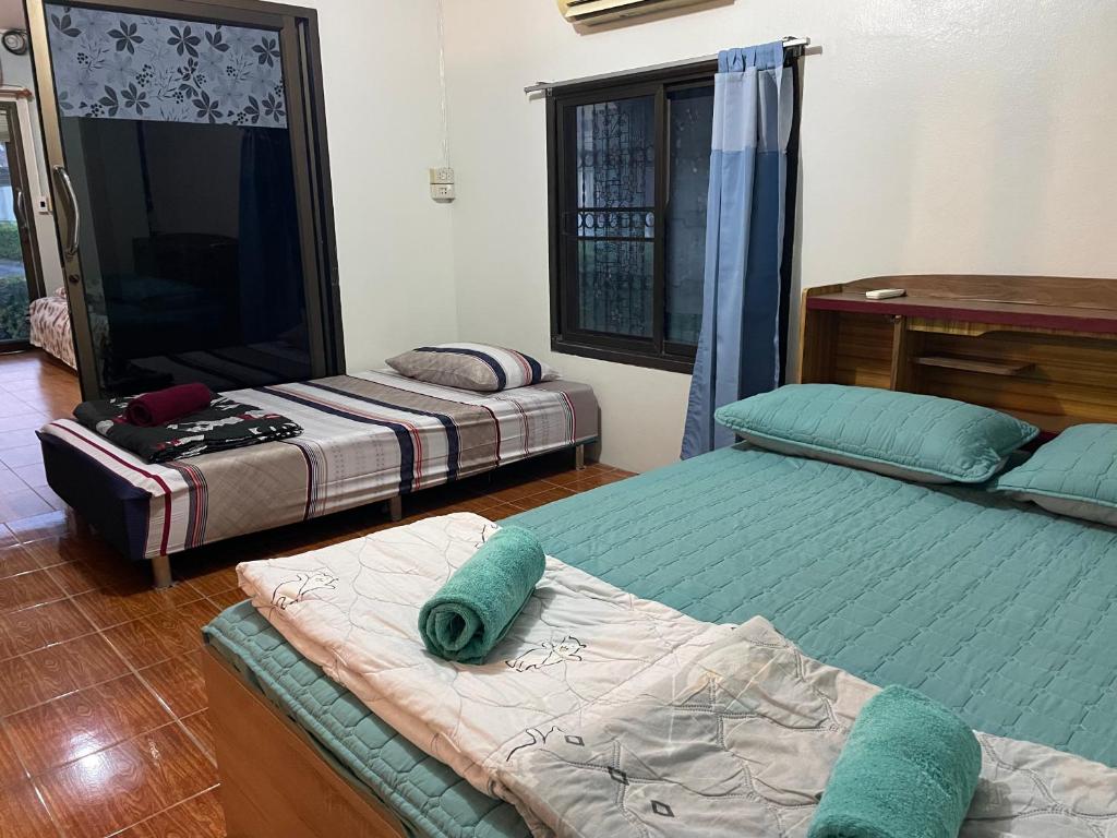 Postel nebo postele na pokoji v ubytování Casa Bonita Kanchanaburi