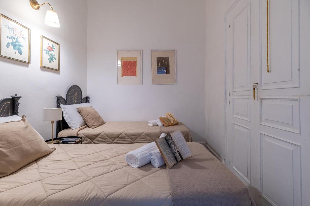 Postel nebo postele na pokoji v ubytování Milonghita Apartment Ortigia