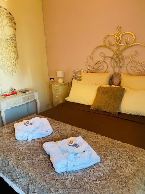 Postel nebo postele na pokoji v ubytování Camera luminosa per viaggiatori