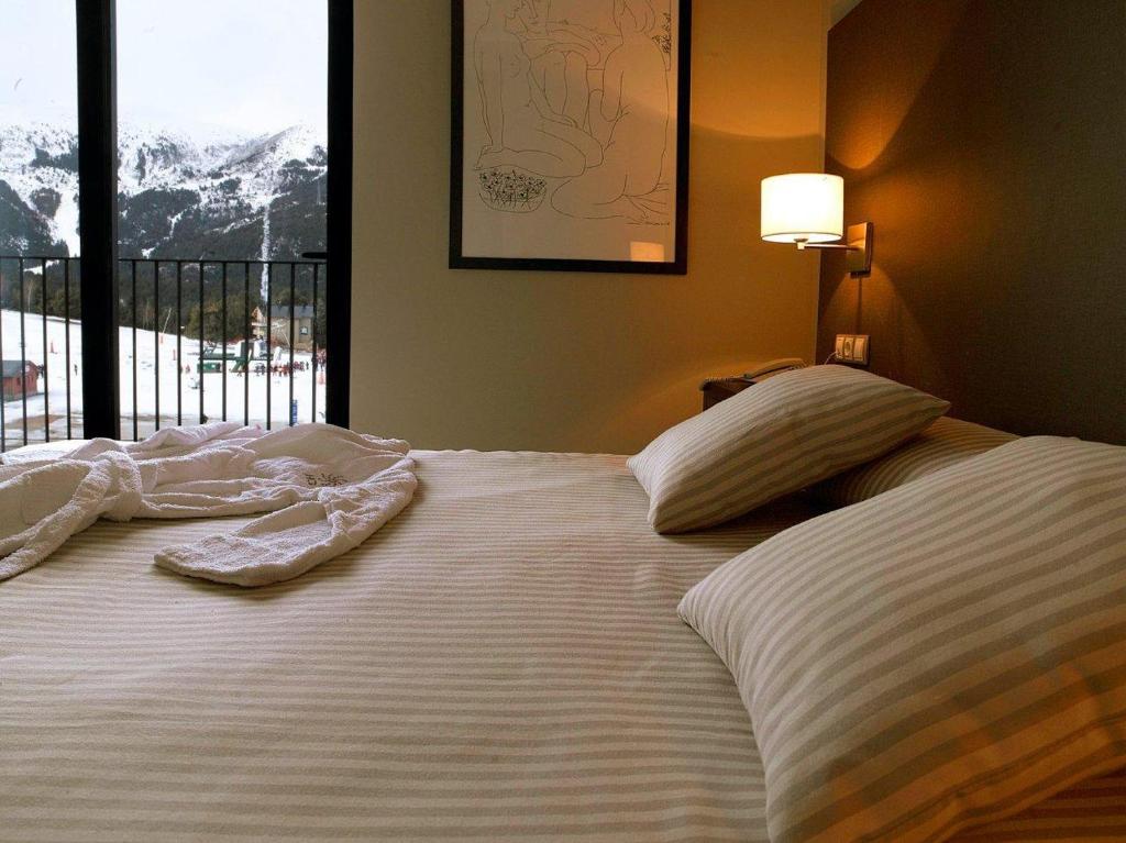 Postel nebo postele na pokoji v ubytování HG La Molina