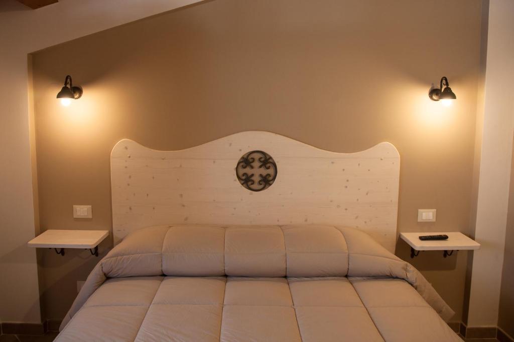 Postel nebo postele na pokoji v ubytování Il Vicoletto B&B