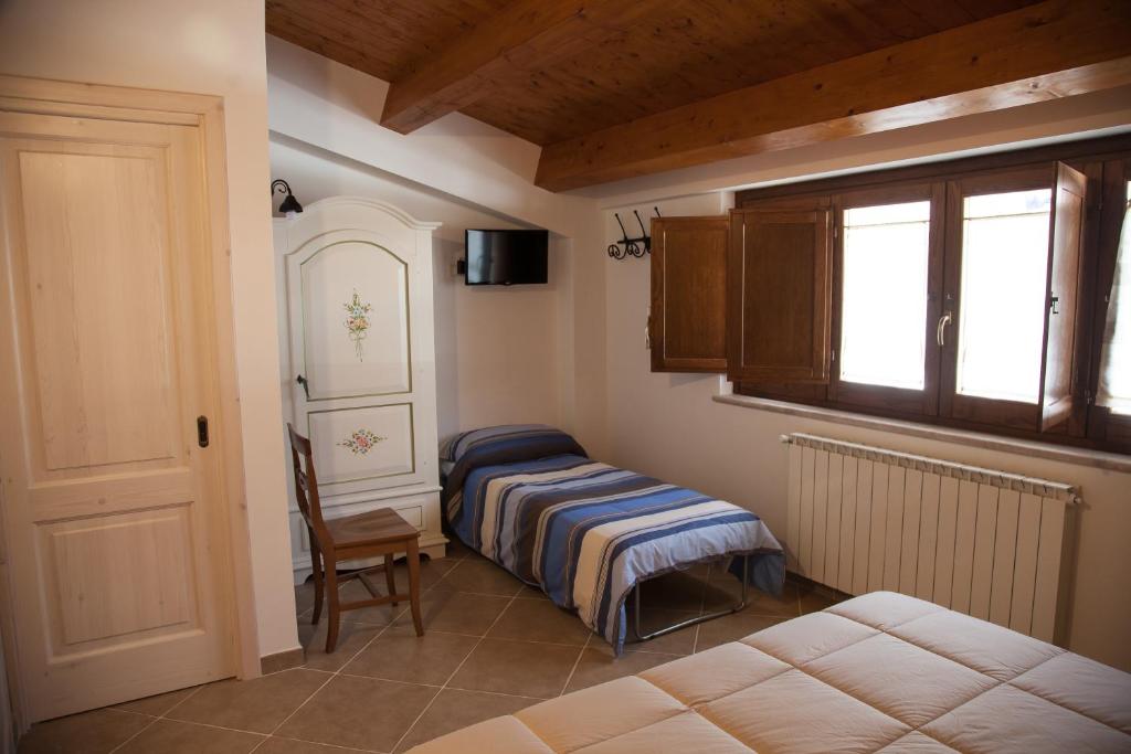 Postel nebo postele na pokoji v ubytování Il Vicoletto B&B
