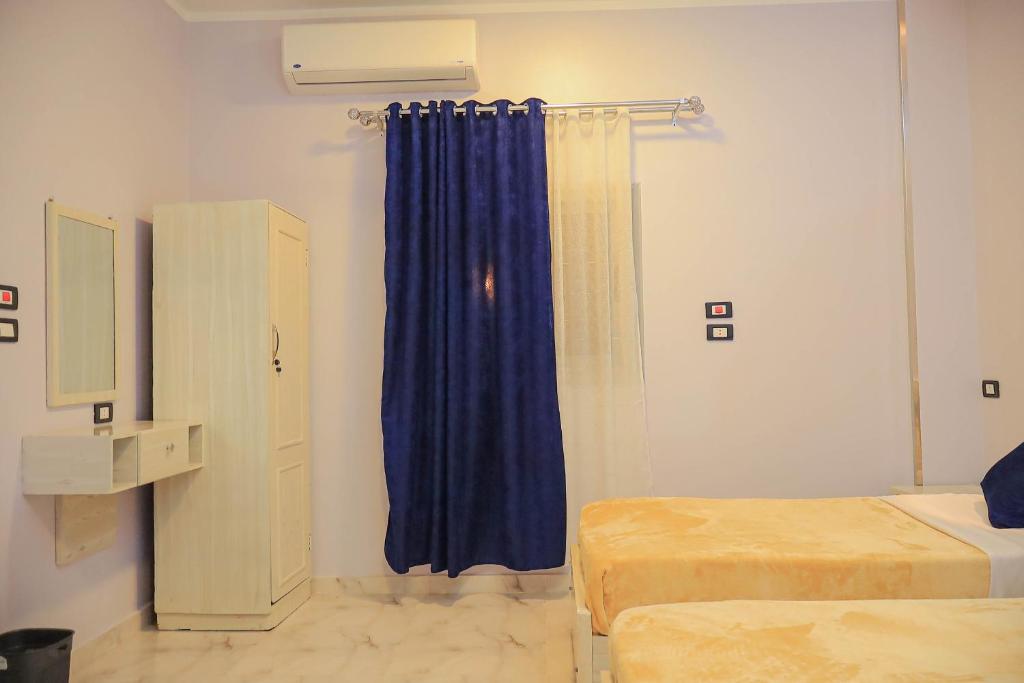 Postel nebo postele na pokoji v ubytování Rayan Nubian Guest House