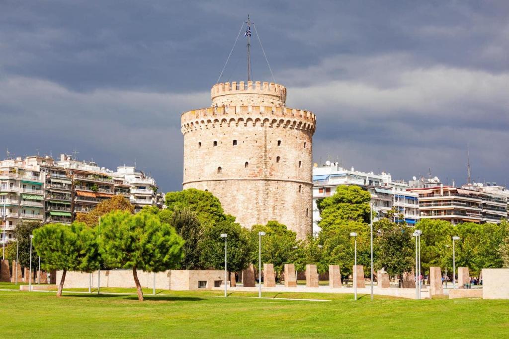 a tall white tower in the middle of a park at Prime location - 2 bd Boutique apartment in Thessaloniki