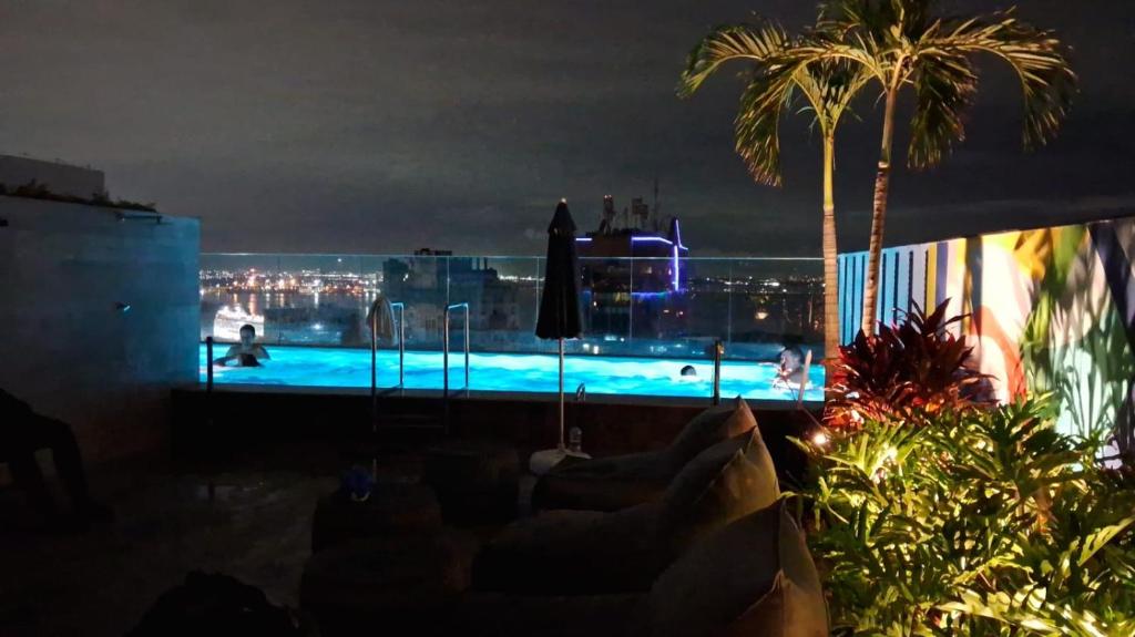 a view of a swimming pool at night at Studio super Nova Centro-RJ in Rio de Janeiro