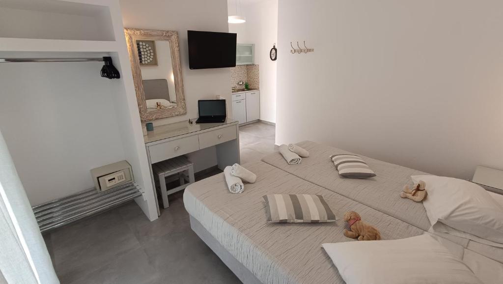 Postel nebo postele na pokoji v ubytování Cyclades Studios