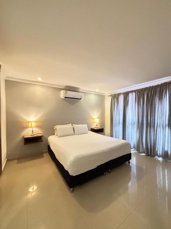 Postel nebo postele na pokoji v ubytování Hotel Amoek