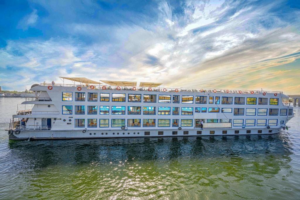 a large cruise ship in the water at sunset at Cleopatra Nile Cruise From Luxor 3&4 Nights Every Saturday and Monday, Thursday in Luxor