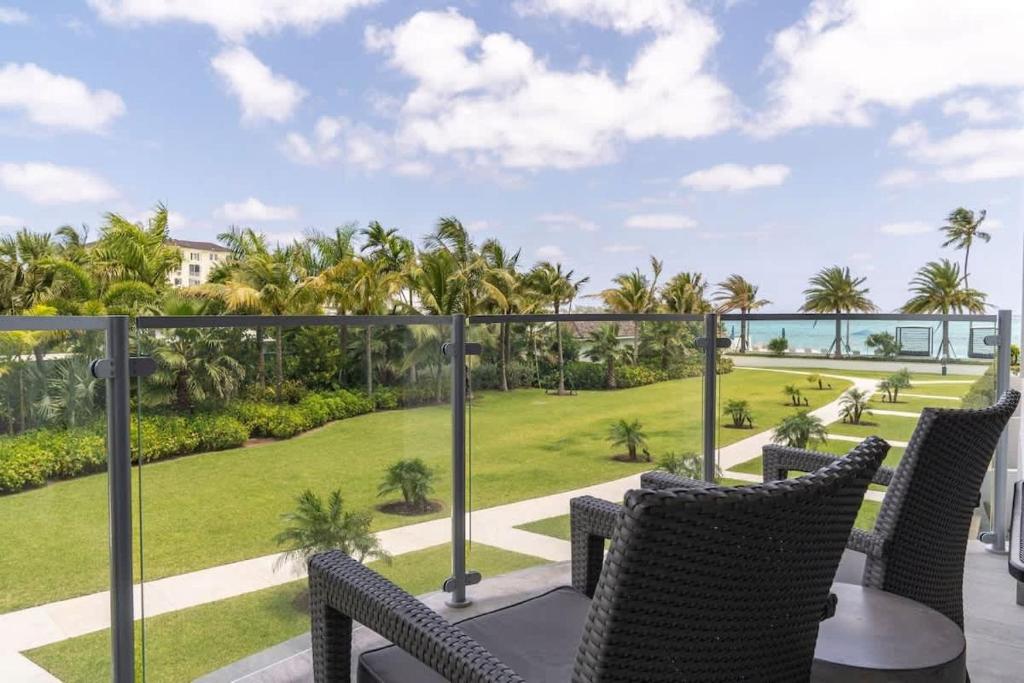 a view of the ocean from the balcony of a resort at Modern Condo at One Cable Beach with Balcony in Nassau