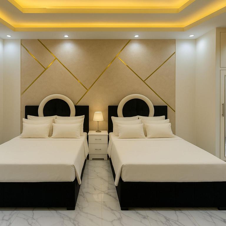 A bed or beds in a room at Porto Said Tourist Resort Luxury Hotel Apartment