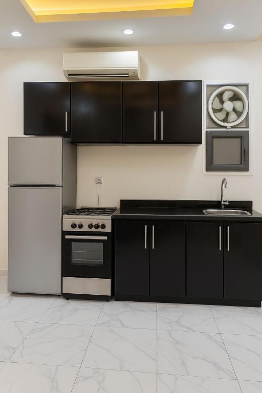 A kitchen or kitchenette at Porto Said Tourist Resort Luxury Hotel Apartment