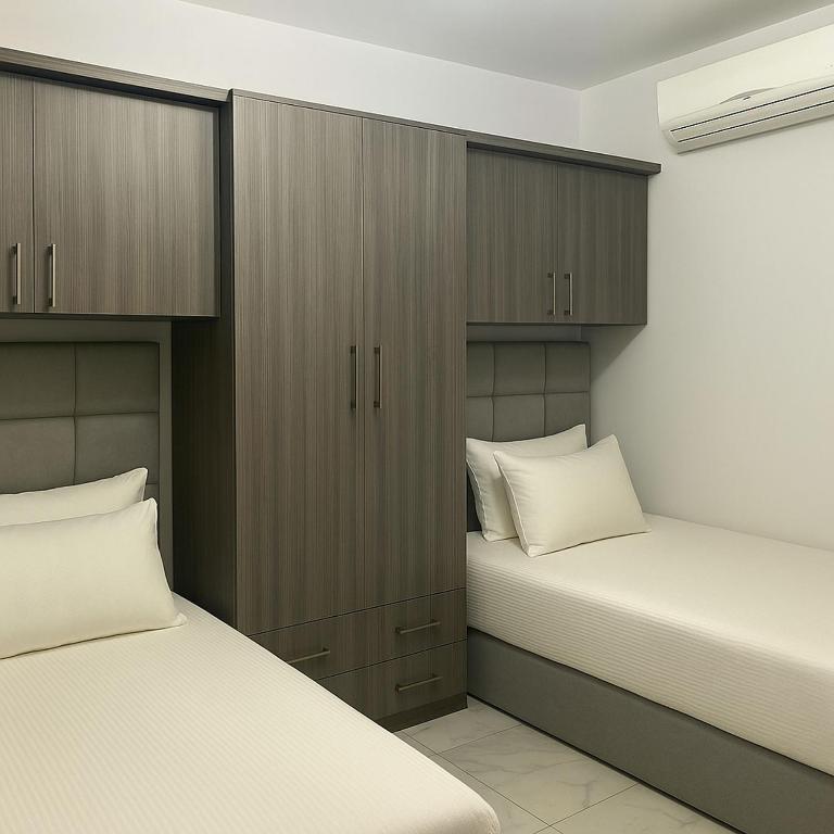 A bed or beds in a room at Porto Said Tourist Resort Luxury Hotel Apartments