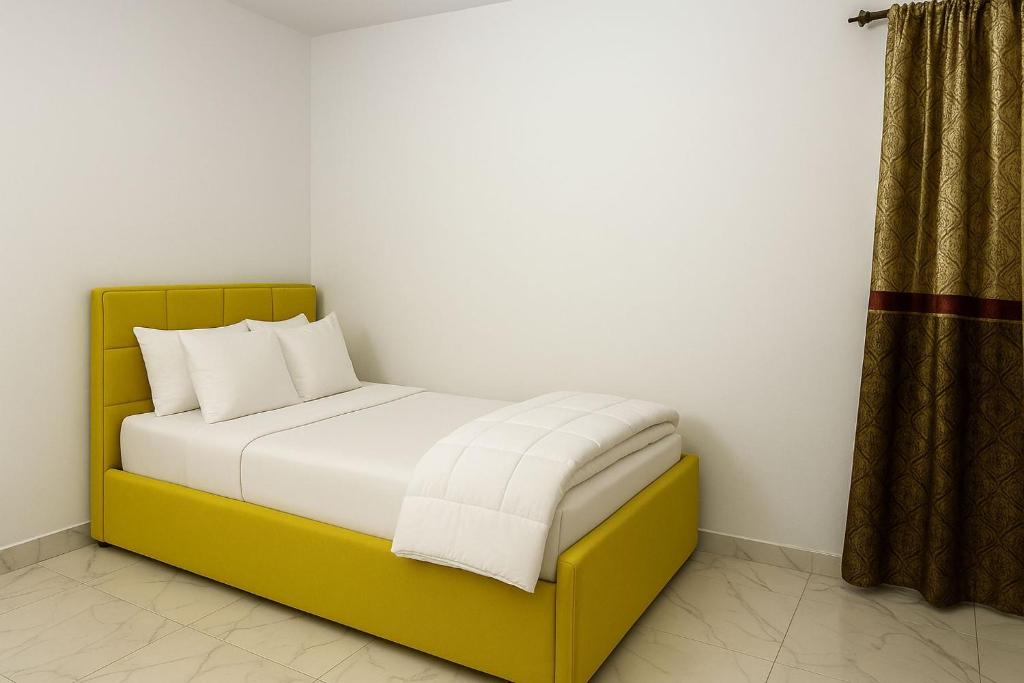 A bed or beds in a room at Porto Said Tourist Resort Luxury Hotel Apartments