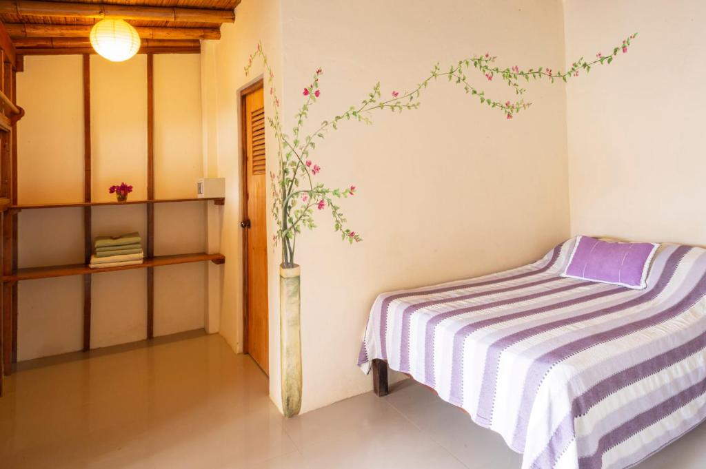 Postel nebo postele na pokoji v ubytování Muelle Viejo Bungalows