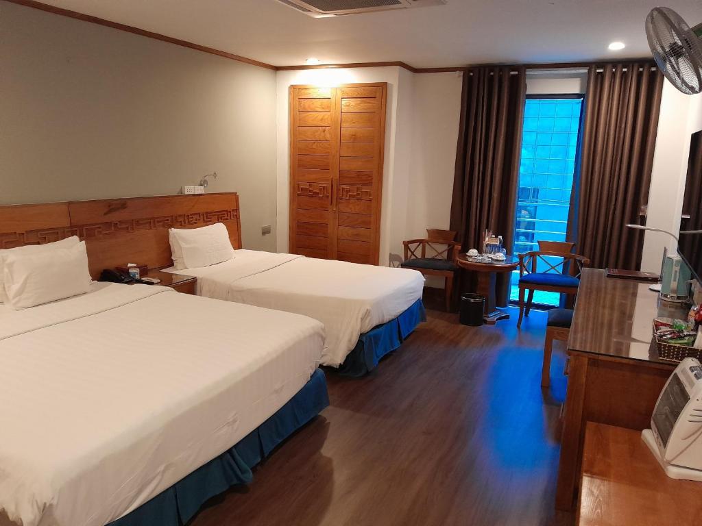 Postel nebo postele na pokoji v ubytování A25 Hotel - 45 Phan Chu Trinh