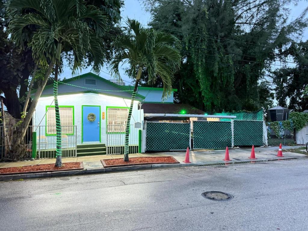 a house with orange cones on the side of a street at OQP Vacations in Miami