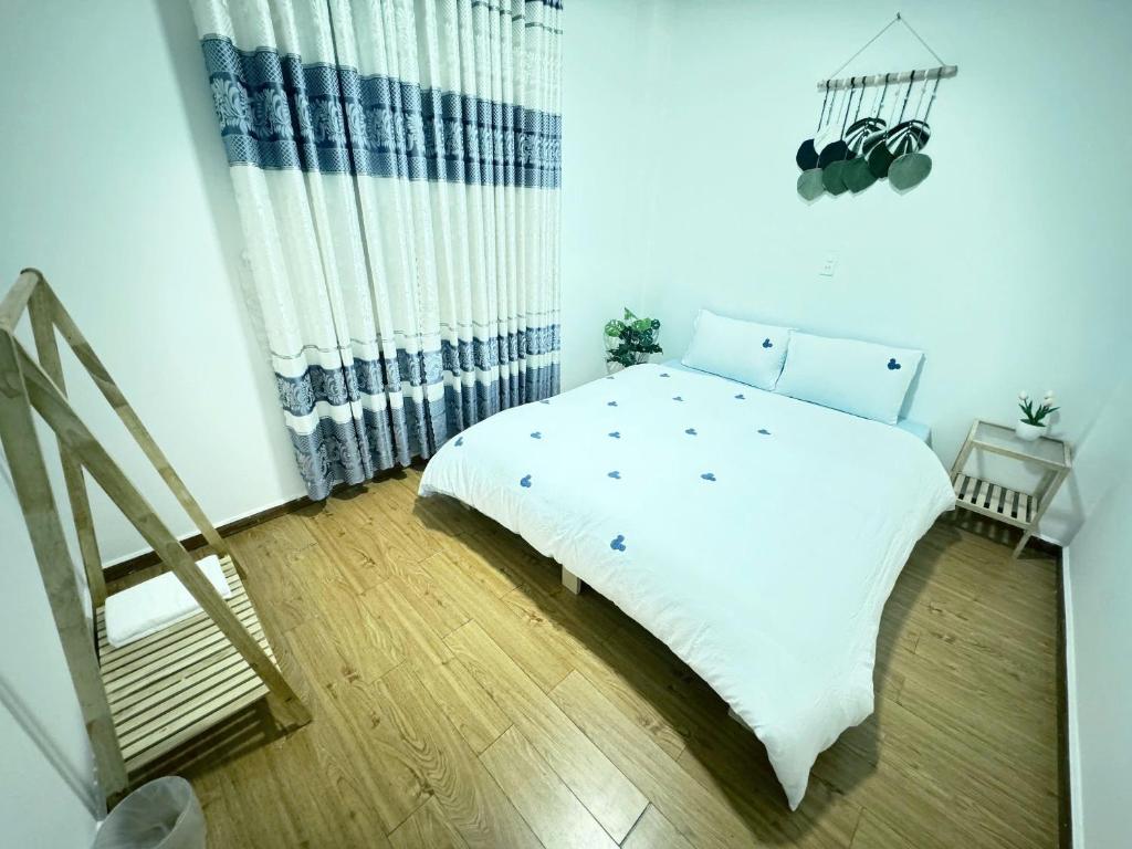 Postel nebo postele na pokoji v ubytování An Nhiên House
