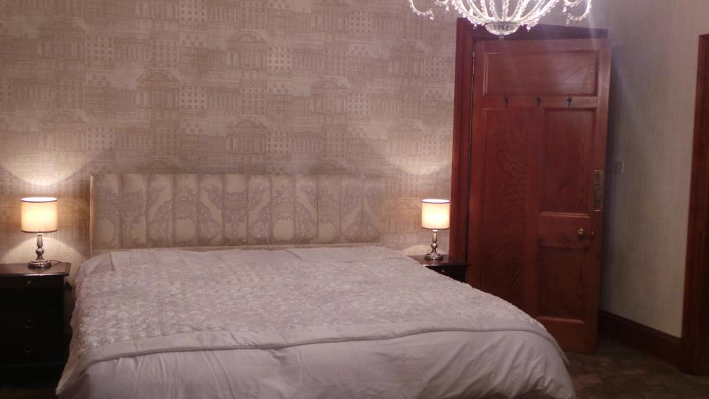 A bed or beds in a room at St Michaels Guest House