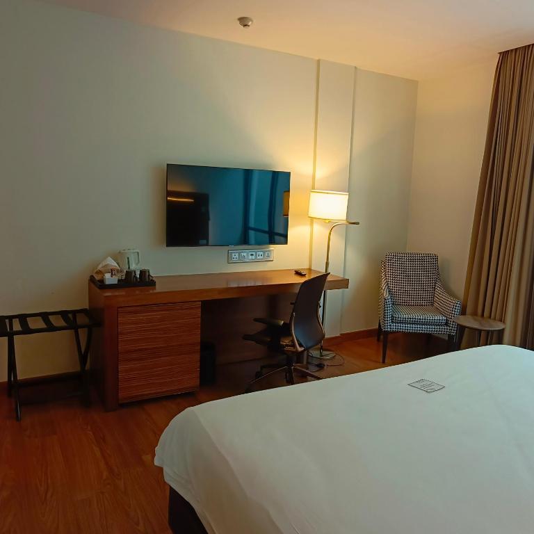 Postel nebo postele na pokoji v ubytování Sacha's Hotel Uno