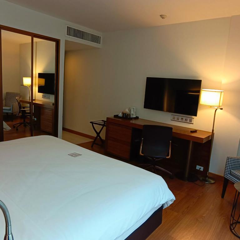 TV a/nebo společenská místnost v ubytování Sacha's Hotel Uno