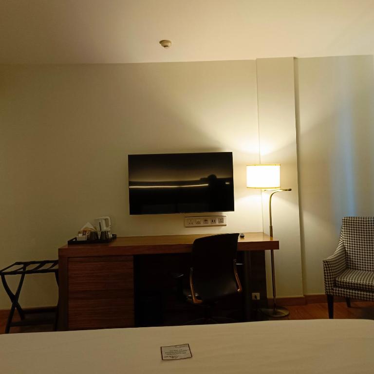 TV a/nebo společenská místnost v ubytování Sacha's Hotel Uno