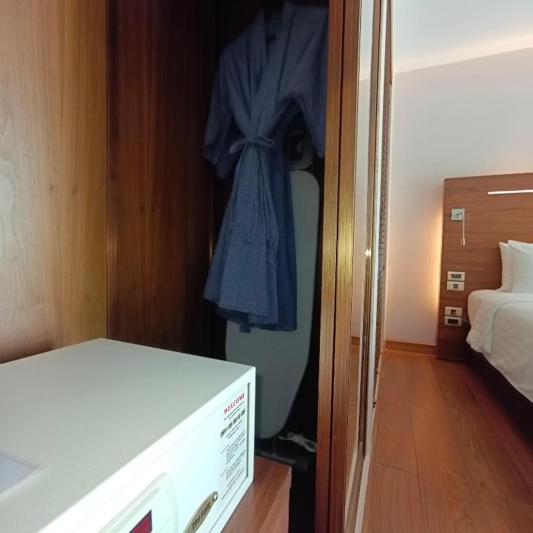 Postel nebo postele na pokoji v ubytování Sacha's Hotel Uno