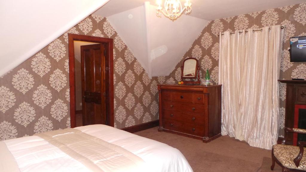 A bed or beds in a room at St Michaels Guest House