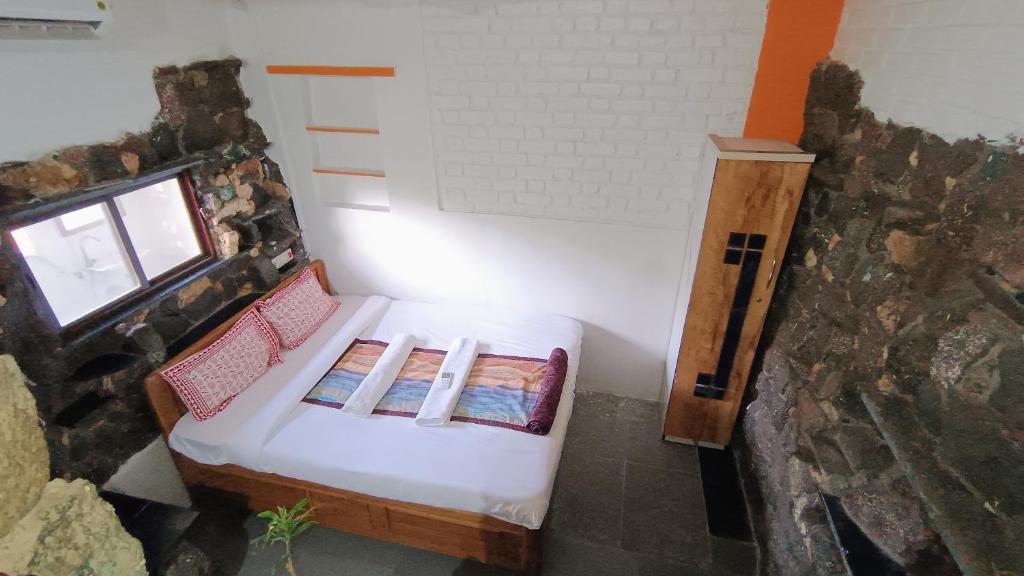 Postel nebo postele na pokoji v ubytování Abhayanand Agro Tourism