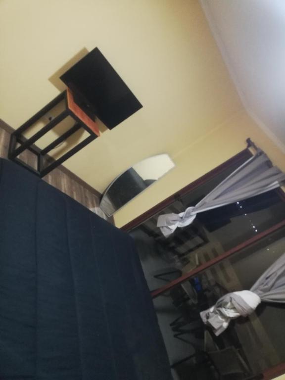 Postel nebo postele na pokoji v ubytování Hotel Bella Vista