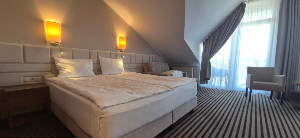 Postel nebo postele na pokoji v ubytování Hotel White
